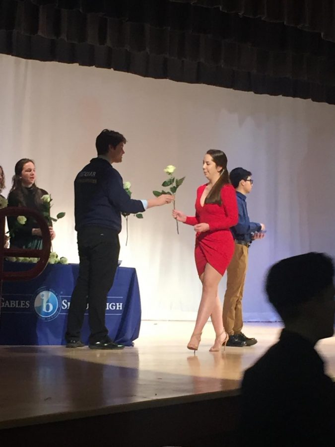 After hearing their names announced, the juniors walked across the stage to greet Mr. Costa and Ms. Van Wyk and receive a white rose from the senior volunteers. 