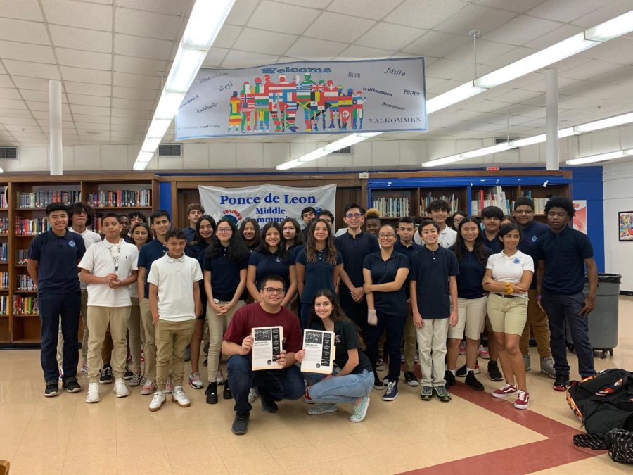 Michaela Torres and Daniel Fernandez in the media center at Ponce De Leon Middle School, with the group of kids they presented to.