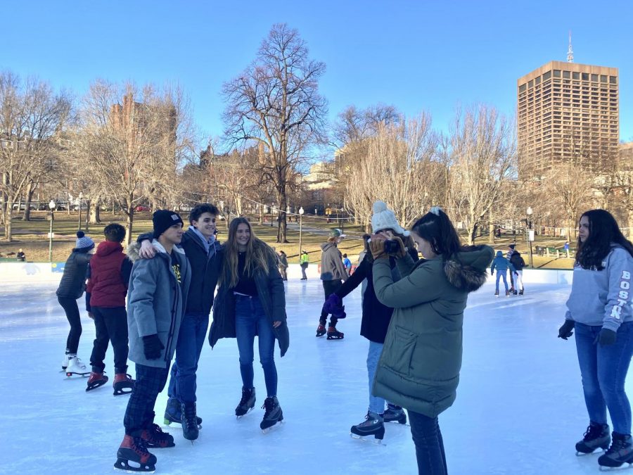 Junior Alexandra Torres photographs several other students while ice skating.