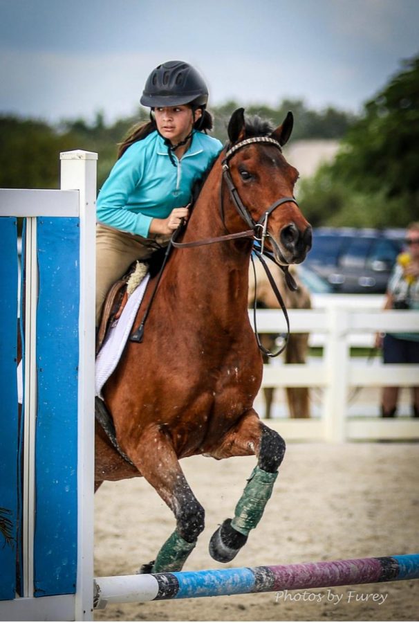 Victoria Mavarez and her horse, Indie, during a competition in 2016. 