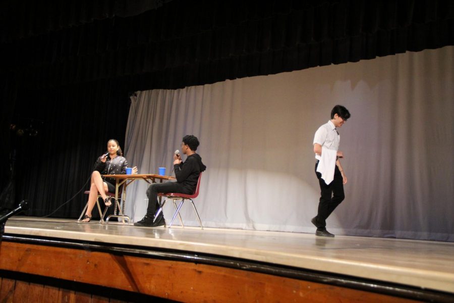 Students performed a short skit about a couple in a restaurant.