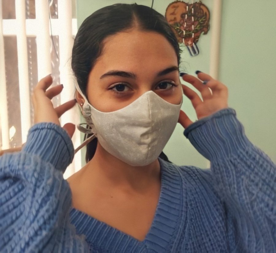 Stephanie Duque wearing one of her first masks she made.
