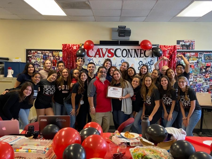 Principal Costa stands with the CavsConnect staff after awarding them a Sunshine Standout plaque.