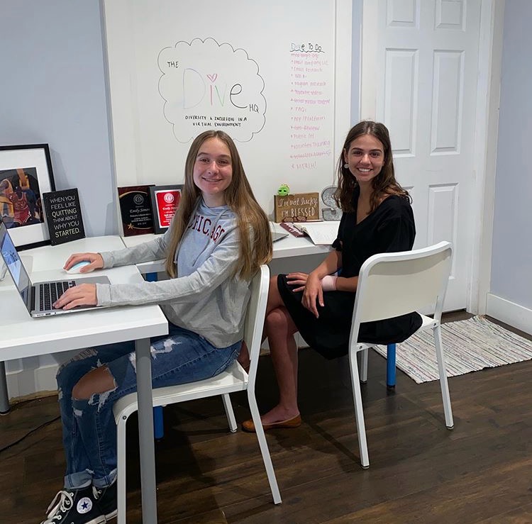 Sisters Audrey (left) and Emily (right) working hard on building their website and establishing contact with similar organizations. 