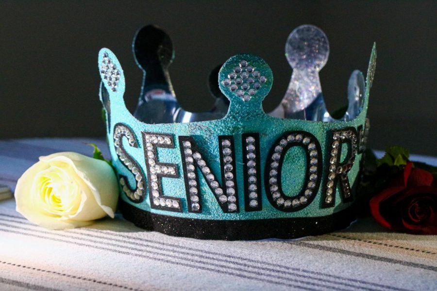Condoleo’s crown has a blue glitter base, black border and has the words “senior’21” bedazzled. 