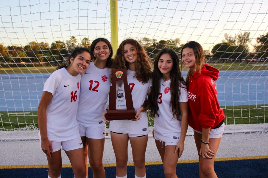 Varsity Juniors pictured with the District Championship trophy.