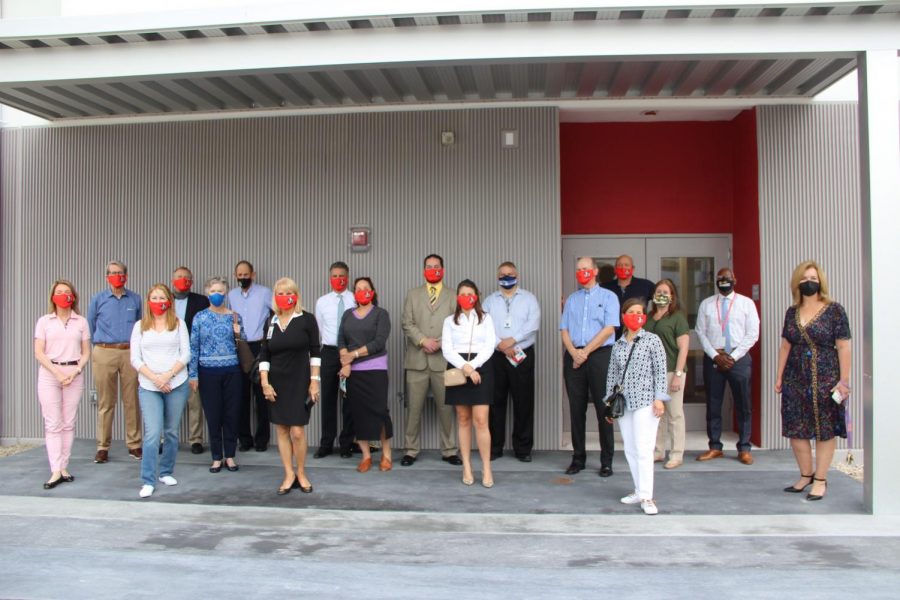 Principal+Ullivarri+stands+alongside+members+of+FOGH+and+Miami-Dade+School+Board+member+Mari+Tere+Rojas+in+front+of+what+will+soon+become+the+outdoor+pavilion+area+of+the+new+building.