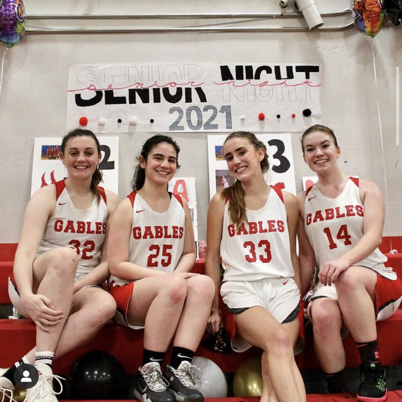 On Jan. 29 the underclassmen of the Lady Cavaliers basketball team said farewell to seniors, Madeline Cohen (furthest left), Isabelle Barbery, Catherine Pasternac and Mia Crabill (furthest right).