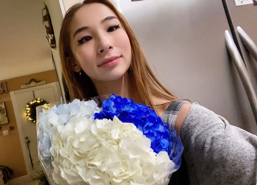 Devon Rall-Taguci surprises her grandmother with the big news with a bouquet of flowers depicting the Yale school colors.