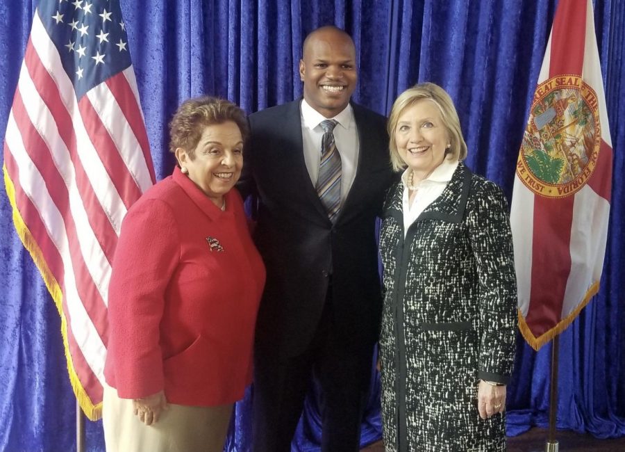 Marcus Dixon is seen here posing with former representative Donna Shalala (left), and former Secretary of State Hillary Clinton (right). (courtesy of Marcus Dixon)