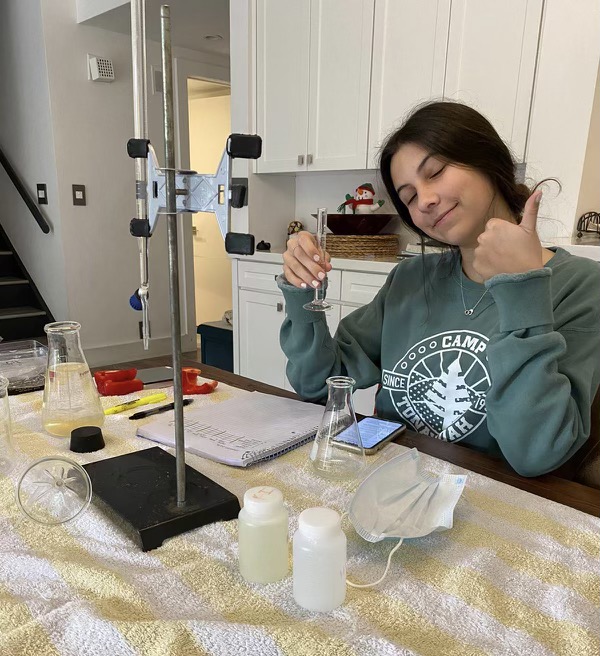 Junior Ella Londono completes her titration experiment in the comfort of her home.