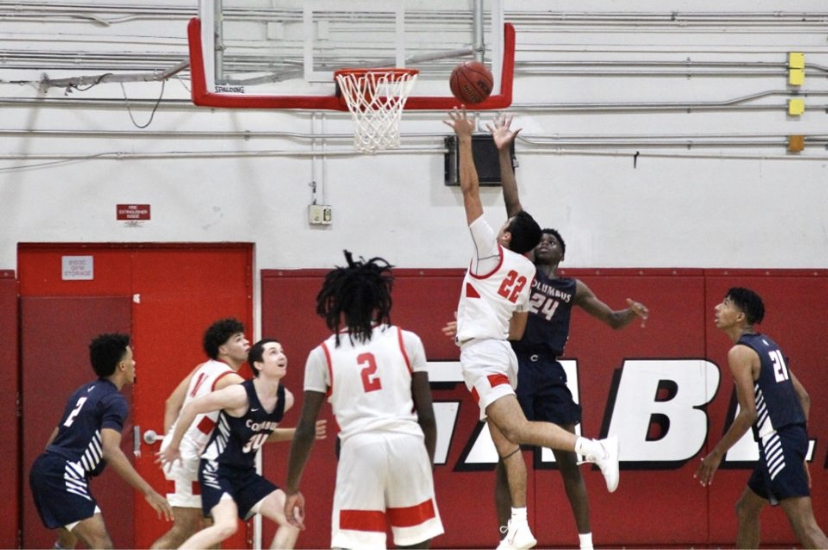 On Feb. 27 against the Columbus Explorers junior Romulo Delgado brought the ball to the hoop despite the Explorers defense.