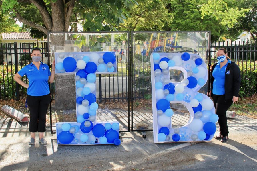 Mrs.Van Wyk and Mrs.Lezcano receiving IB juniors with Ib themed decorations. 