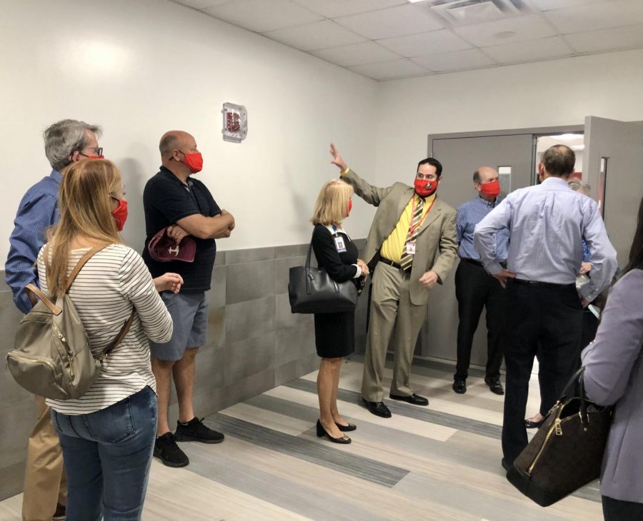 Ullivarri begins his tour right at the entrance of the cafeteria. FOGH members and Mari Were Rojas walk in eagerly to see the progress. 