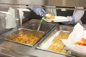 The Gables cafeteria in building 9 also referred to by students as the "new caf" was full once students heard both pasta and cheese sticks were being served. 