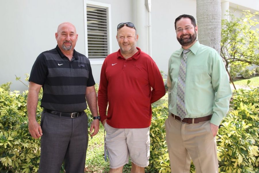 Mr. Welsh, pictured with Athletic Director Mr. Romero (left) and Principal Ullivari (right), after receiving news of Head Coach title.