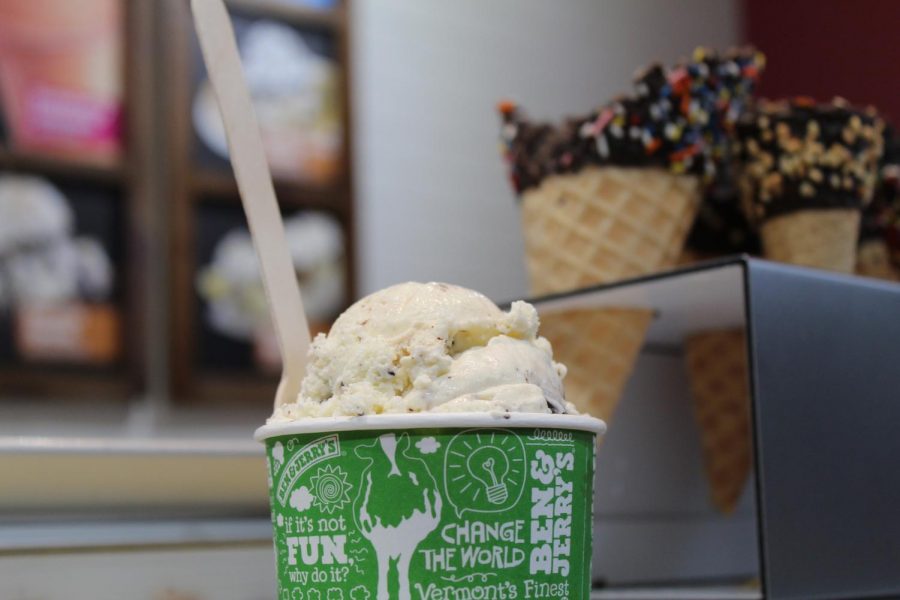 On the counter at the Coral Gables Ben & Jerry's scoop shop, sits a cup of Mint Chocolate Chunk ice cream