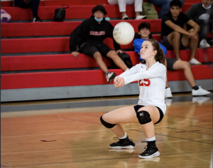 Georgia Rau, libero for the girls JV Volleyball team, getting in position to hit the ball.