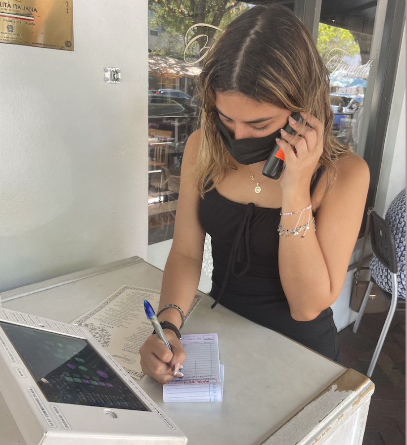 Scheduling reservations for customers is a task Chacon has become comfortable with because her communication and social skills have improved throughout her time working at Farinelli 1937.