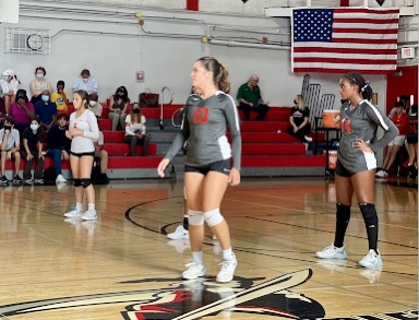 Varsity team members Audrey Noval (Left), Emma Hardie (Middle) and Celina Richardson (Right) during the 8/26 game against John A. Ferguson Senior High School’s girls' varsity volleyball team.