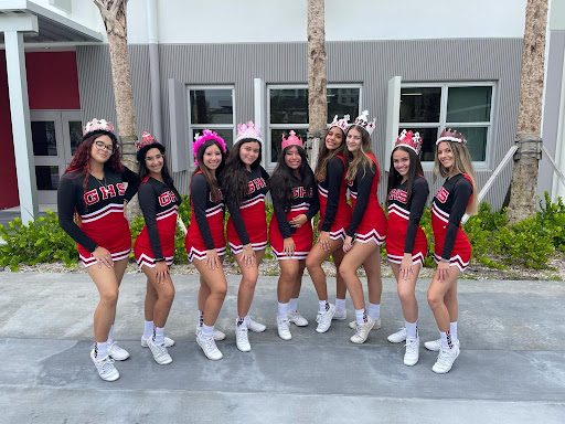 Gables Cheerleaders representing Gables in front of the newly remodeled 6000 building on the first day of school.