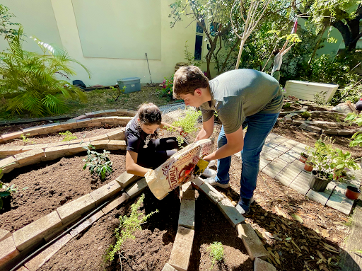 Lucia Chico, one of The Garden Project founders, and a student volunteer working on the first, of hopefully many, communal gardens at Gables.