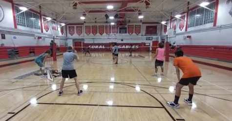 Here the volleyball team can be seen practicing drills in a scrimmage game