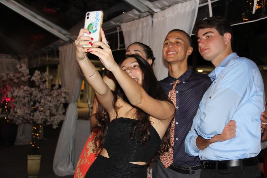 Seniors pose for a selfie, enjoying their last homecoming as Cavaliers.