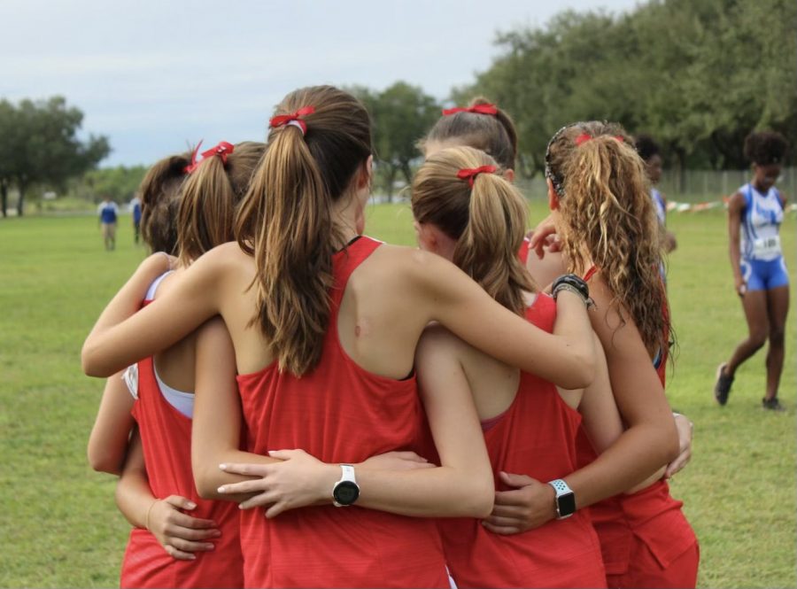 Before racing, the girls team exchanges a few words, wishing each other good luck and sending positive messages to one another.