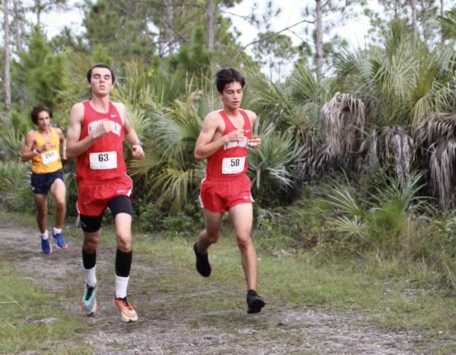 Robert Weckel and Santiago Gonzalez running side by side, a technique that allows them to maintain a fixed pace and motivate each other.