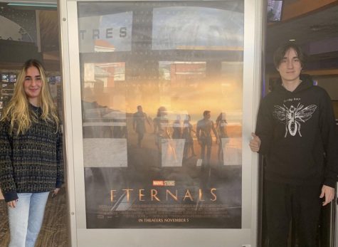 After viewing the film, seniors Lauren Gregorio and Nicholas Calindro pose with the promotional poster.