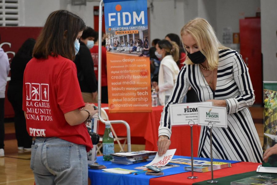 Junior Ariadna Torras communicating with a college representative. 