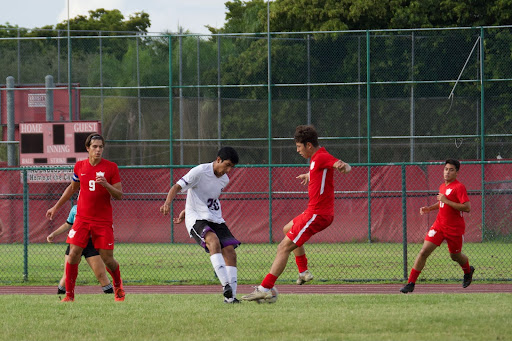 Sophomore Jordan Bueso dribbled past a defender while trying to secure his second goal of the game.