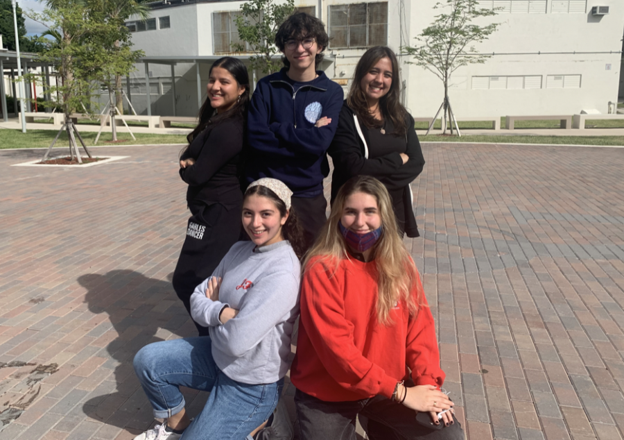 Celebrating their Silver Knight nominations, the group of Gables seniors stand together.