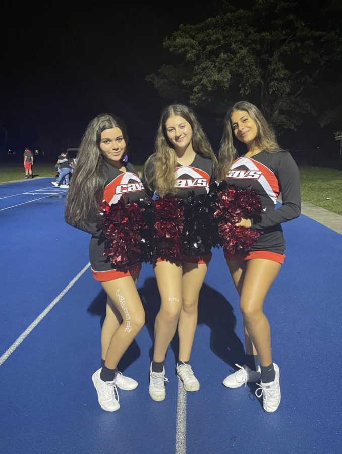 Co-Captains Kylie Alvarez and Ingrid Moises, along with senior Abigail Colodner celebrate their senior night after the football game.