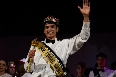 Romulo Delgado, Mr. Basketball, excitedly waves to the crowd after being crowned Mr. Coral Gables.