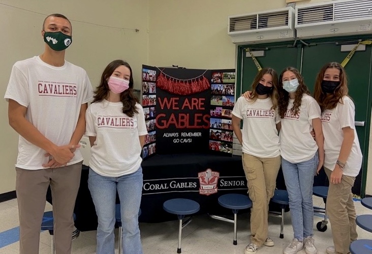 Some of Gables' former Carver Hornets went back to their middle school to pass out treats for honor roll recipients.