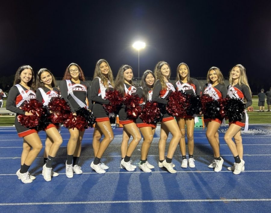 Senior+cheerleaders+donned+tiaras+and+sashes+at+their+final+football+game.