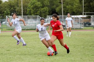 Senior Sabrina Bonavita rushes across defenders in hopes of scoring for the Lady Cavaliers.