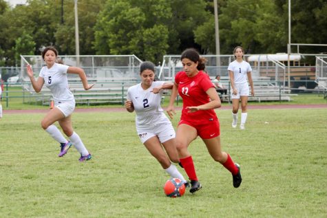 Senior Sabrina Bonavita rushes across defenders in hopes of scoring for the Lady Cavaliers.