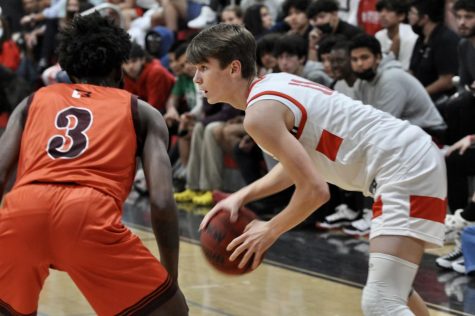 Senior Seraphin Devallet faced off against a South Miami opponent during the Jan. 25 basketball game.