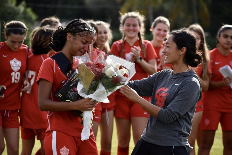 Showering+the+veteran+players+in+appreciation%2C+Coach+Alexia+gave+every+senior+a+bouquet+of+flowers.+