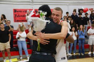 Senior Lawrence Stampino-Strain hugging Coach Shoon after the momentous Senior Night game.