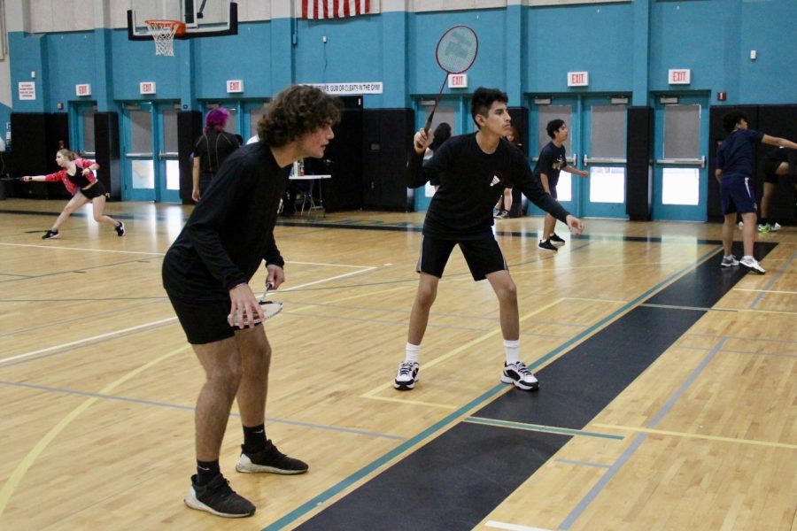 Sophomores Adriaan Guerrero and Manuel Espinoza warming up for their first match of the season.