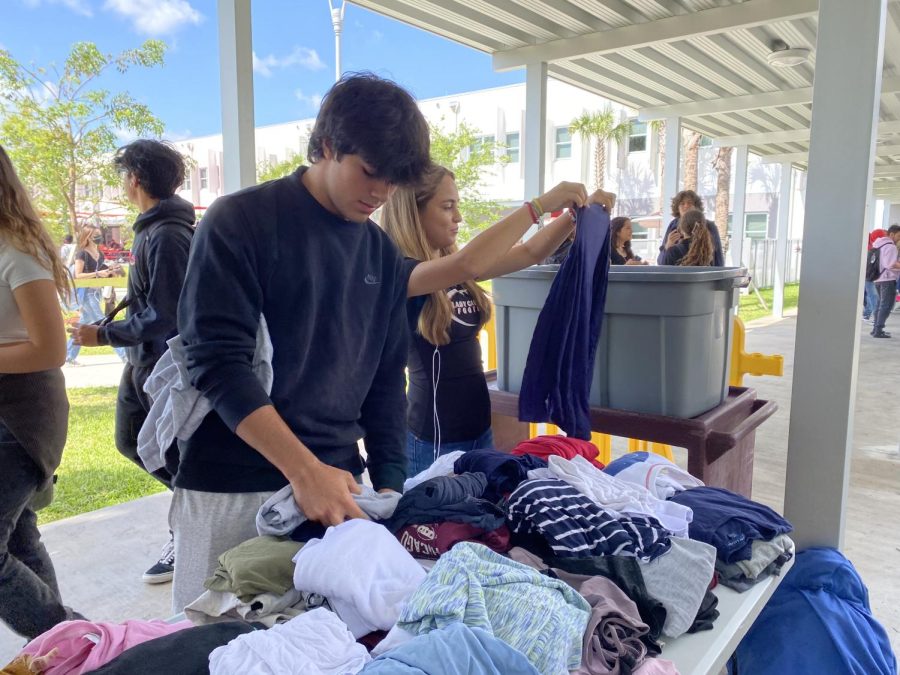 Cavaliers volunteered to set up the store and stayed for both lunches, making sure the clothes were organized.