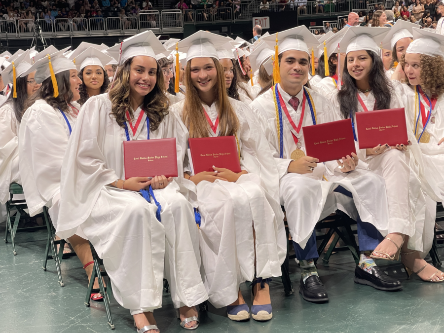 Graduates gather with their diplomas in hand to celebrate their four years at Gables.