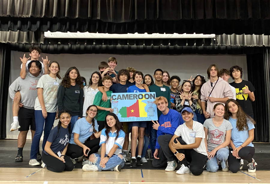 Campers and student volunteers of Cameroon pose, demonstrating their team pride.