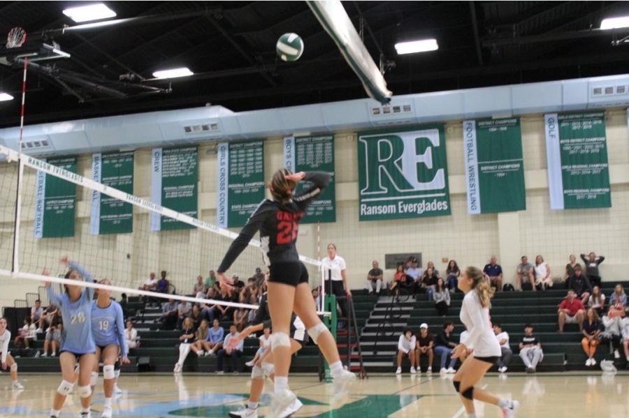 Lady Cavs' left hitter leaps into the air to perform a rally. (Courtesy of Griffin ???)