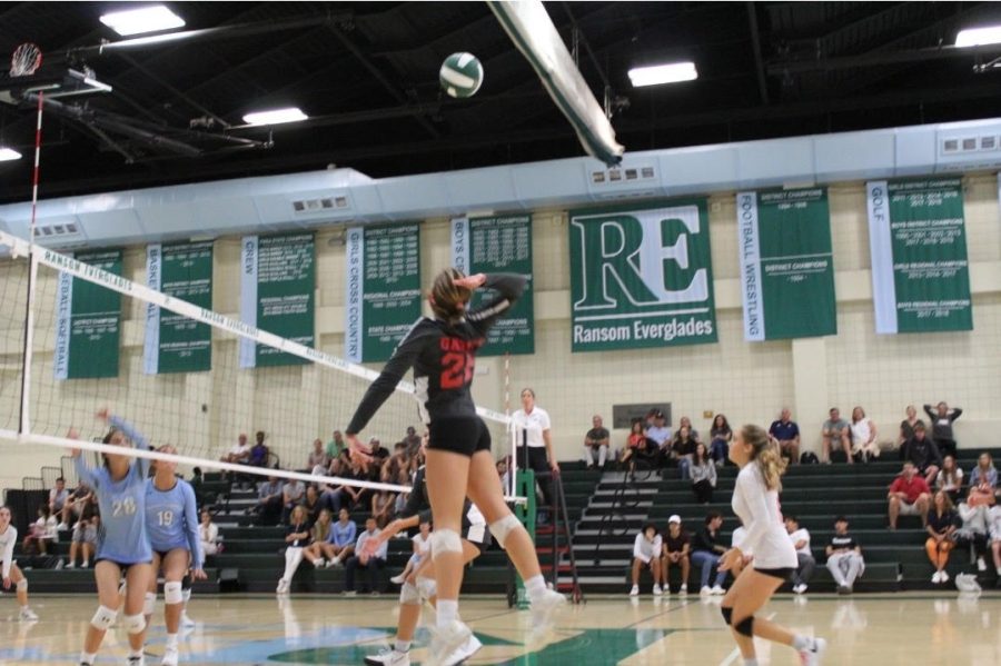 Lady Cavs left hitter leaps into the air to perform a rally. (Courtesy of Griffin ???)