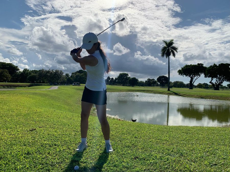 Freshman Anne-Marie hits from the drop zone on a par three at the Girls Golf teams game on Wednesday. 